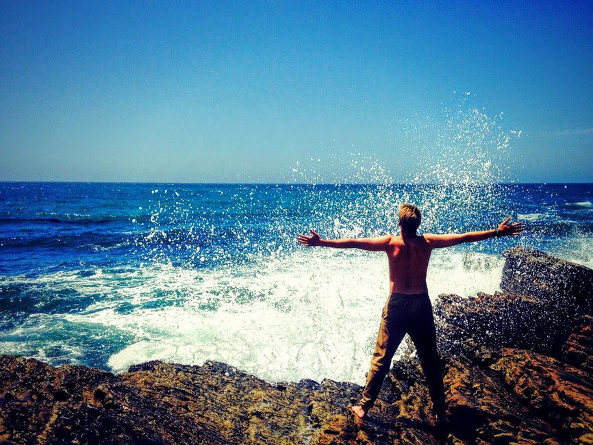 Freedom - man standing on the seashore