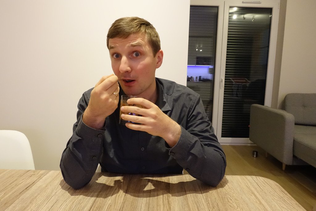 Handsome man eating yummy dessert